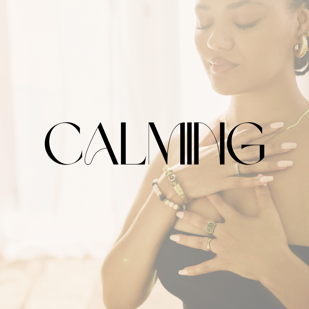 Woman gently holding her chest in a calming pose with the word “Calming.”